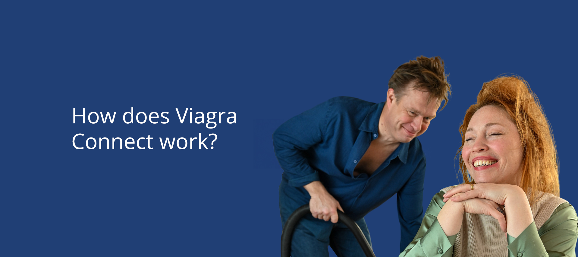 Smiling woman with messy hair at a table, man holding a vacuum cleaner, mug reads 'Woke Up Like This'